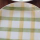 6 green and yellow checkered plates, tea towel