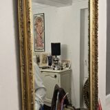 Large antique mirror from the Napoléon III era, finely carved and gilded with gold leaf.