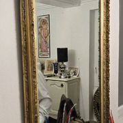 Large antique mirror from the Napoléon III era, finely carved and gilded with gold leaf.