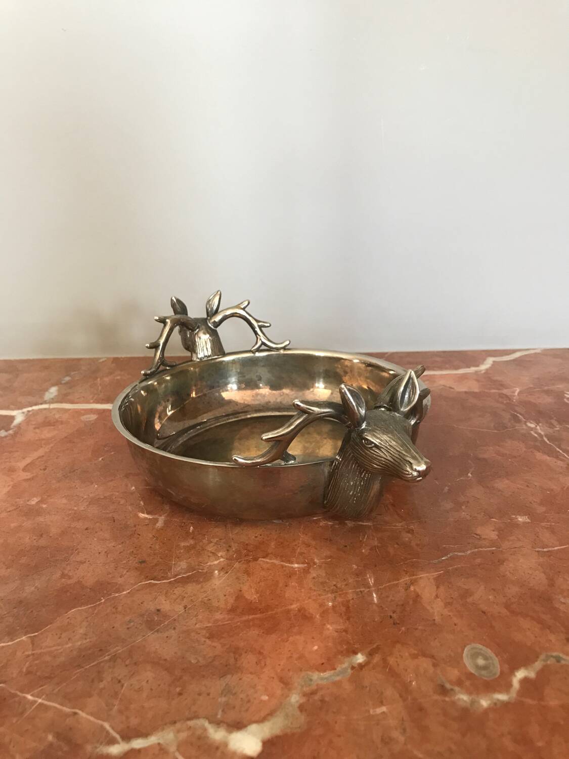 Empty silver metal pocket with deer heads