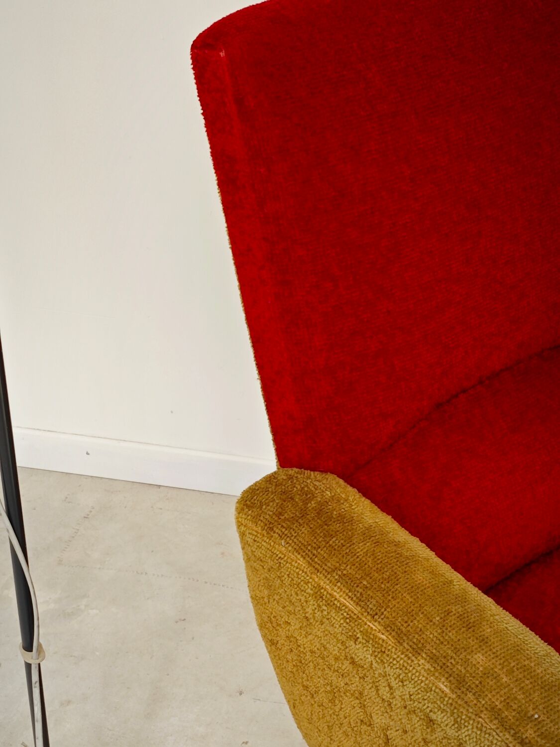 Red and mustard yellow fabric armchair in 1970s style