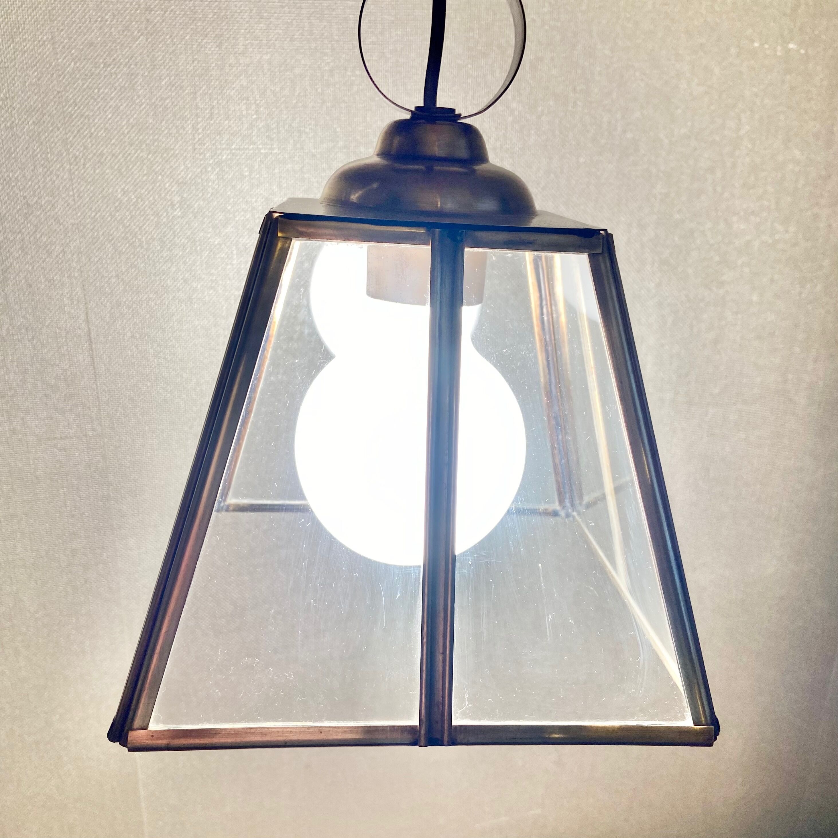 Glass and brass suspension