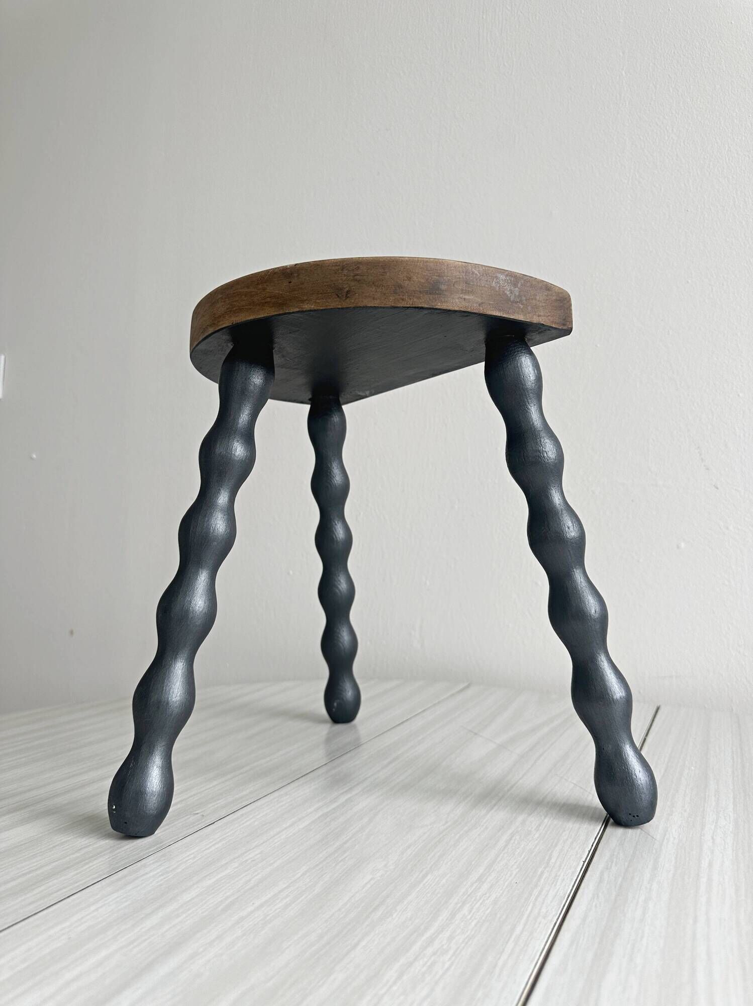 Antique wooden tripod stool with turned legs