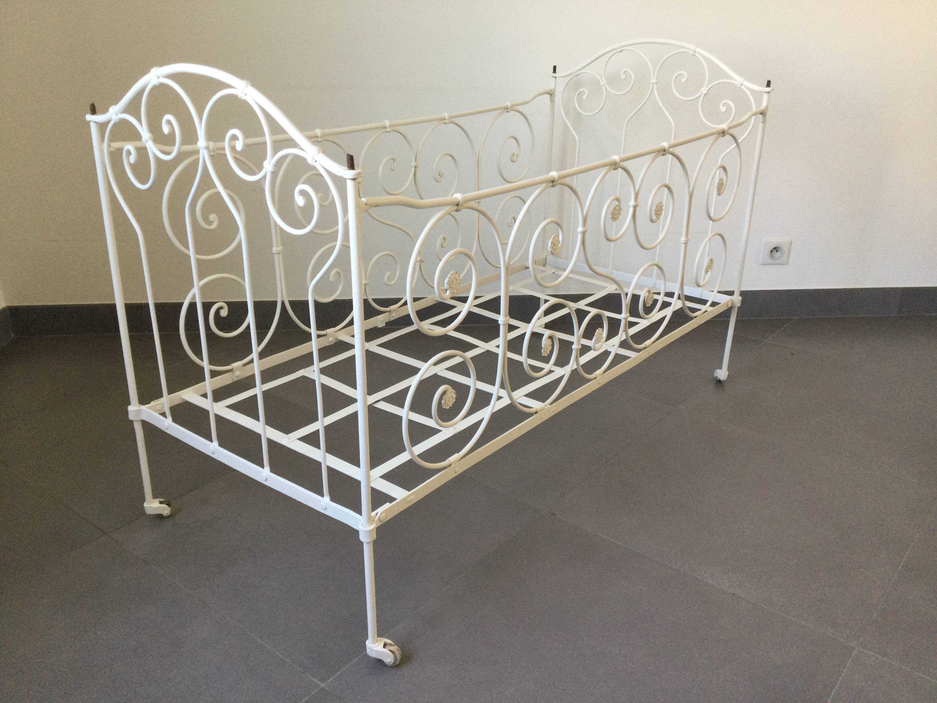 White wrought iron folding bed
