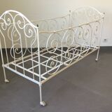 White wrought iron folding bed