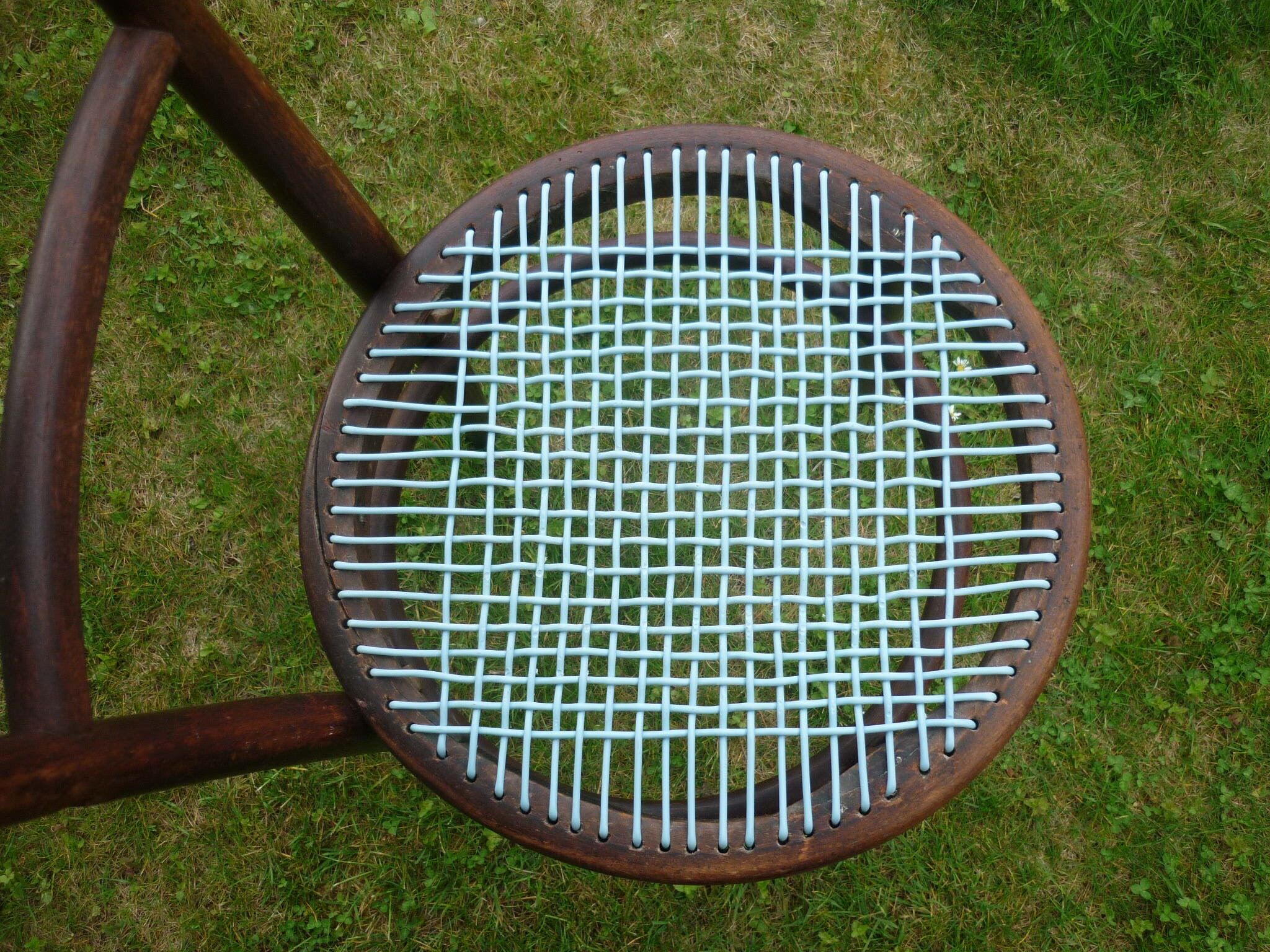 Chair with blue wire braided seat