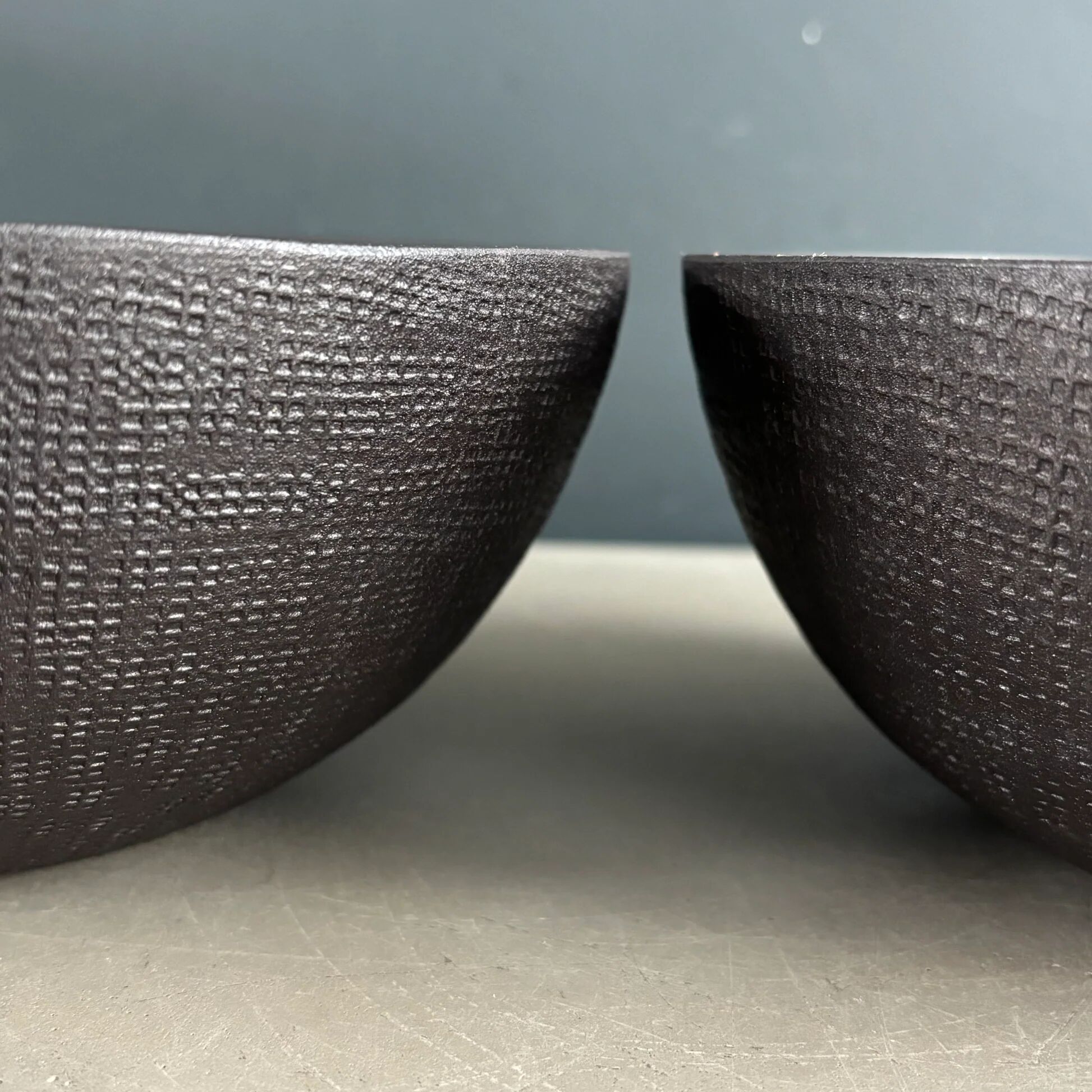 Pair of black lacquered metal catchall bowls