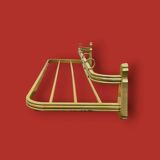 Vintage wall-mounted coat rack in anodised gold aluminium with hat holder.