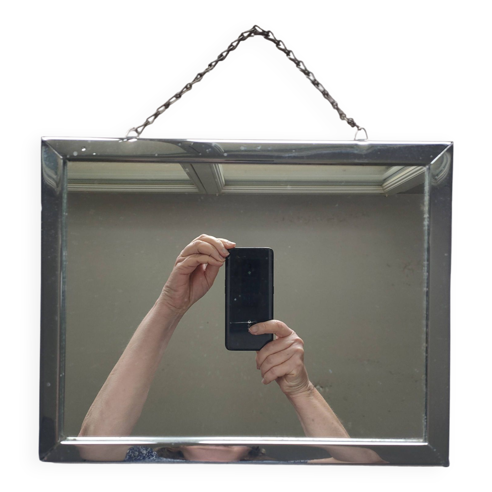 Barber mirror with chain.