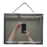 Barber mirror with chain.