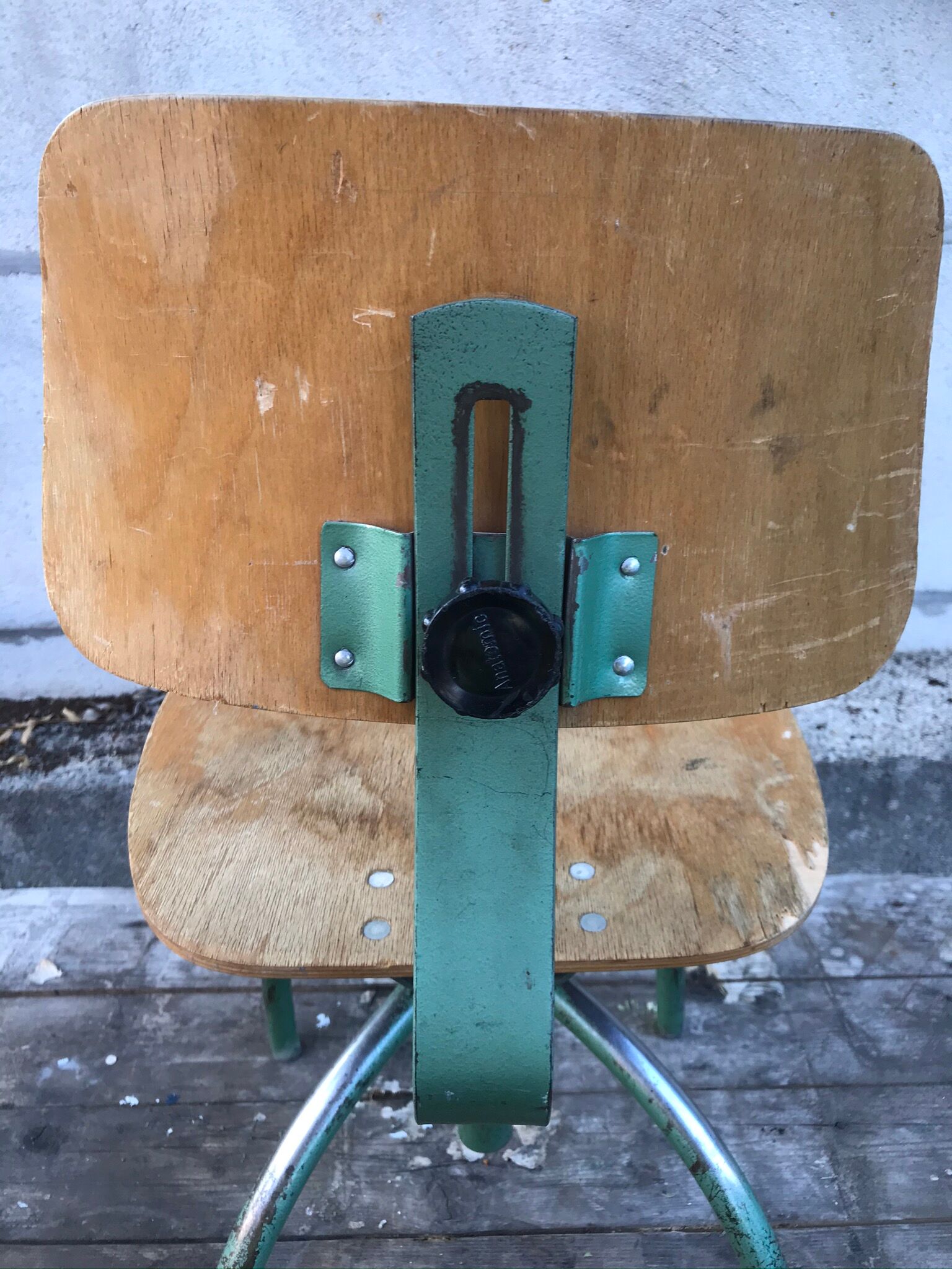 Former green metal workshop chair