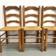 Set of 8 chairs in solid elm with straw seats.