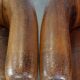 Set of 2 subtle, stately and sturdy club chairs made of sheepskin