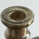Antique mercury glass candlestick with a patina and silver finish.