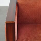 Art Deco design armchair with red fabric upholstery and wooden details