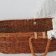 Old rattan bassinet and bedding