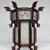 Asian wooden lantern carved with dragons and painted glass panels