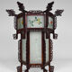 Asian wooden lantern carved with dragons and painted glass panels