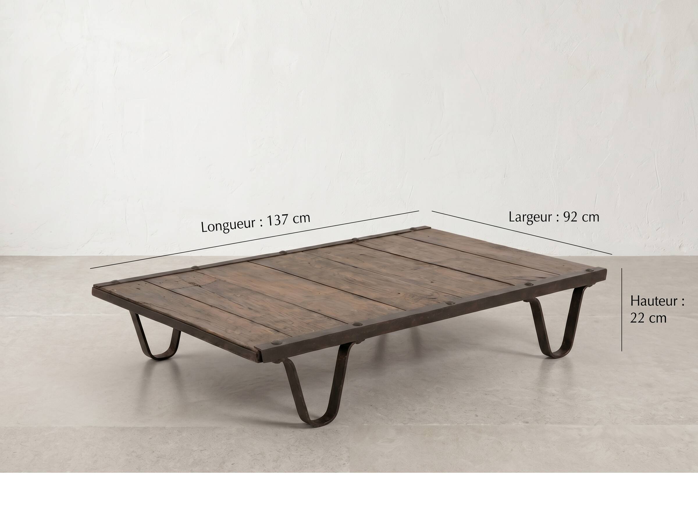 Industrial coffee table made of solid wood and old railway tracks.