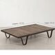 Industrial coffee table made of solid wood and old railway tracks.
