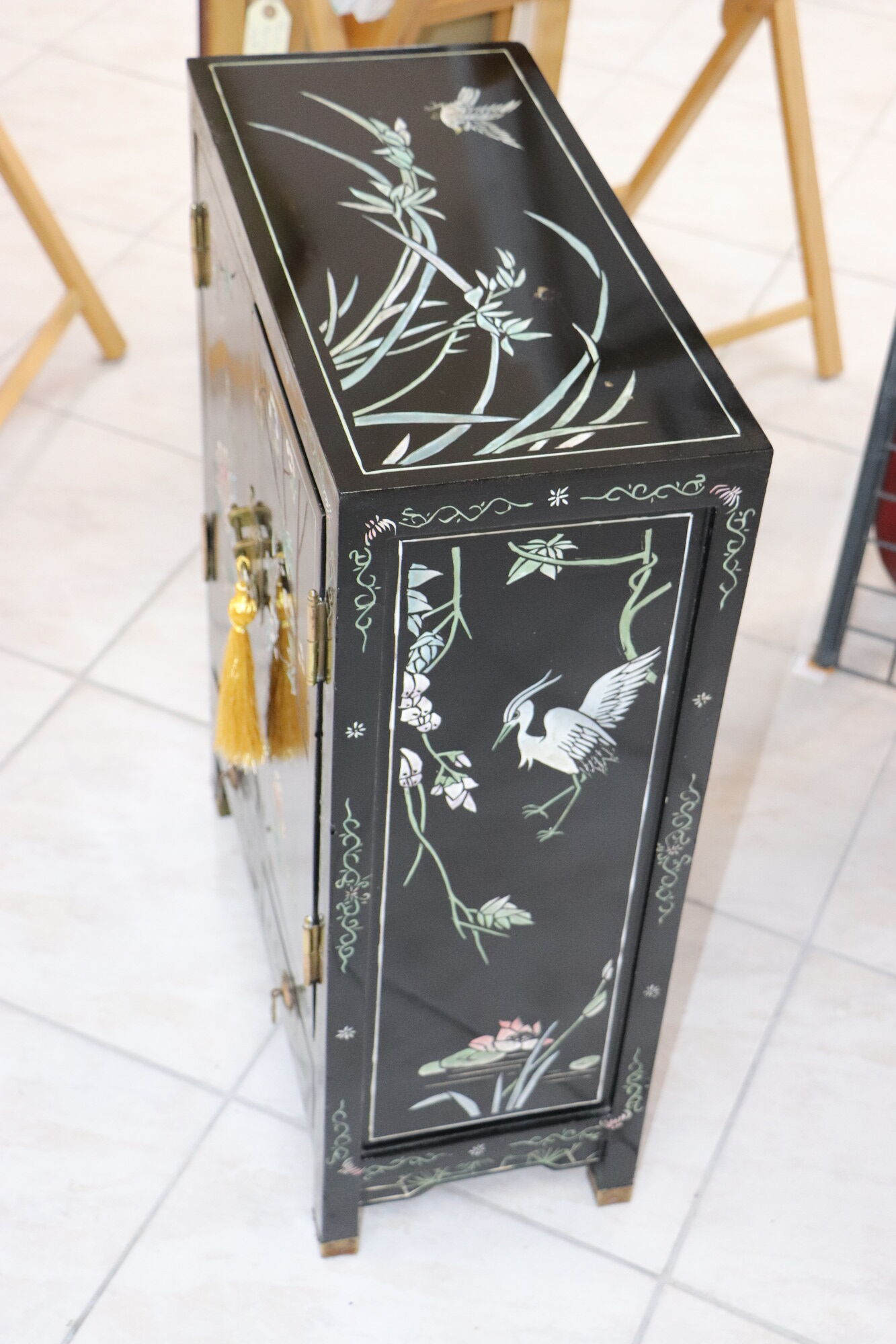 Small storage cabinet or bedside table lacquered black incised and painted