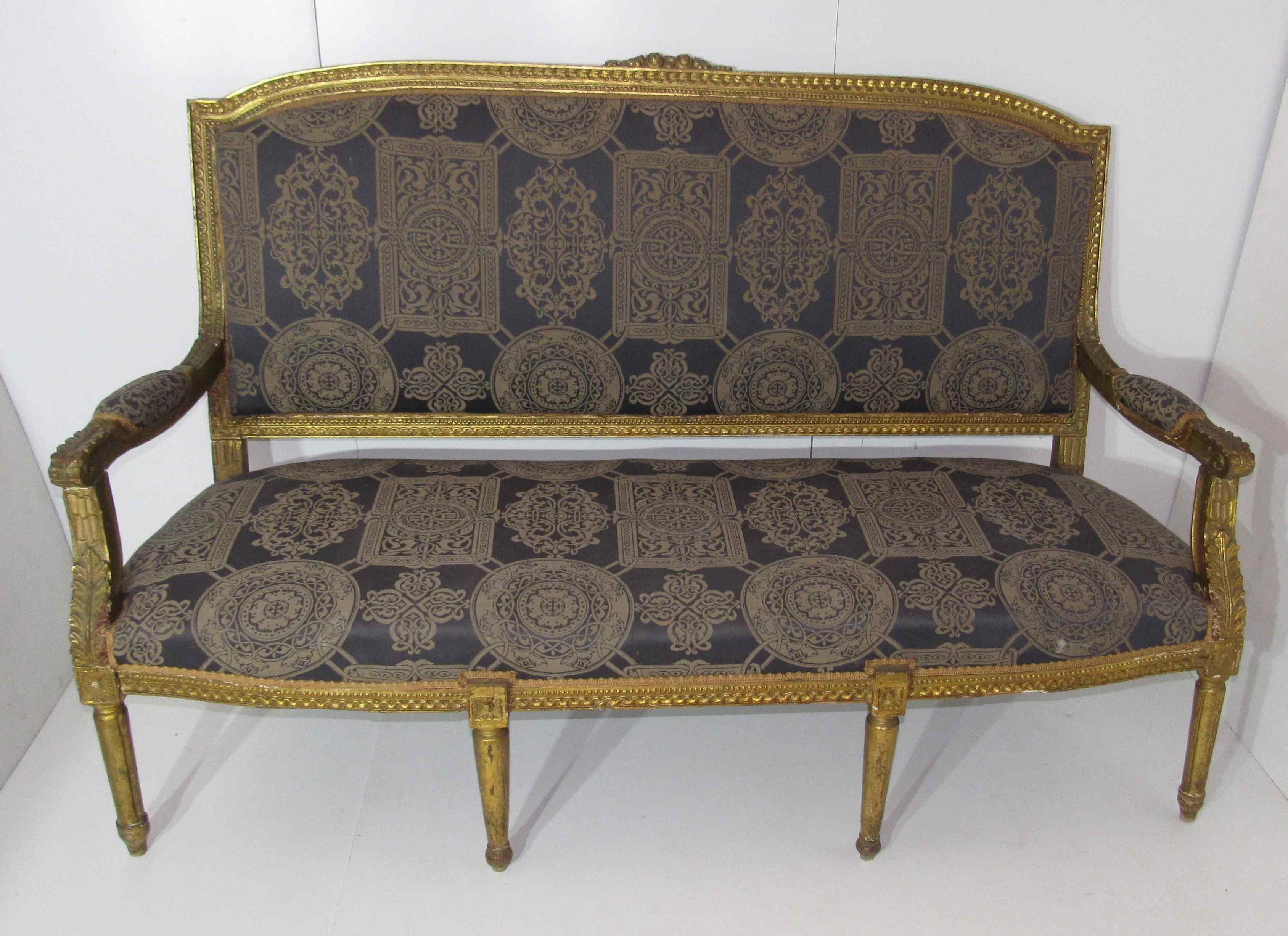4 armchairs and a gilded wooden sofa Louis XVI style