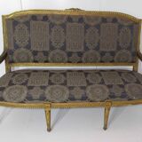 4 armchairs and a gilded wooden sofa Louis XVI style