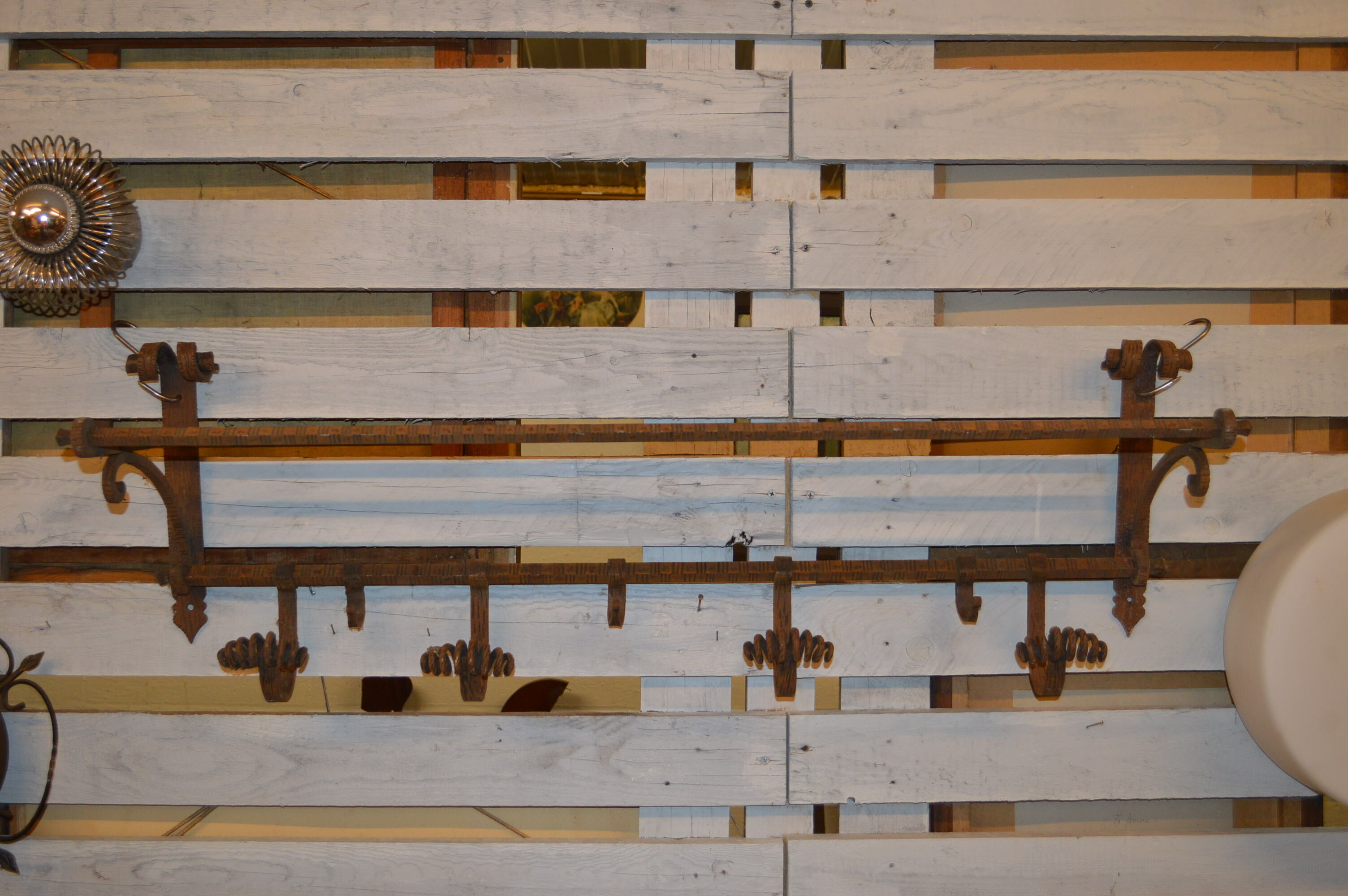 Coats in wrought iron door