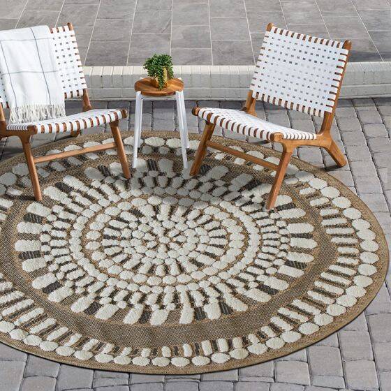 Round jute rug with white relief patterns, 70 cm