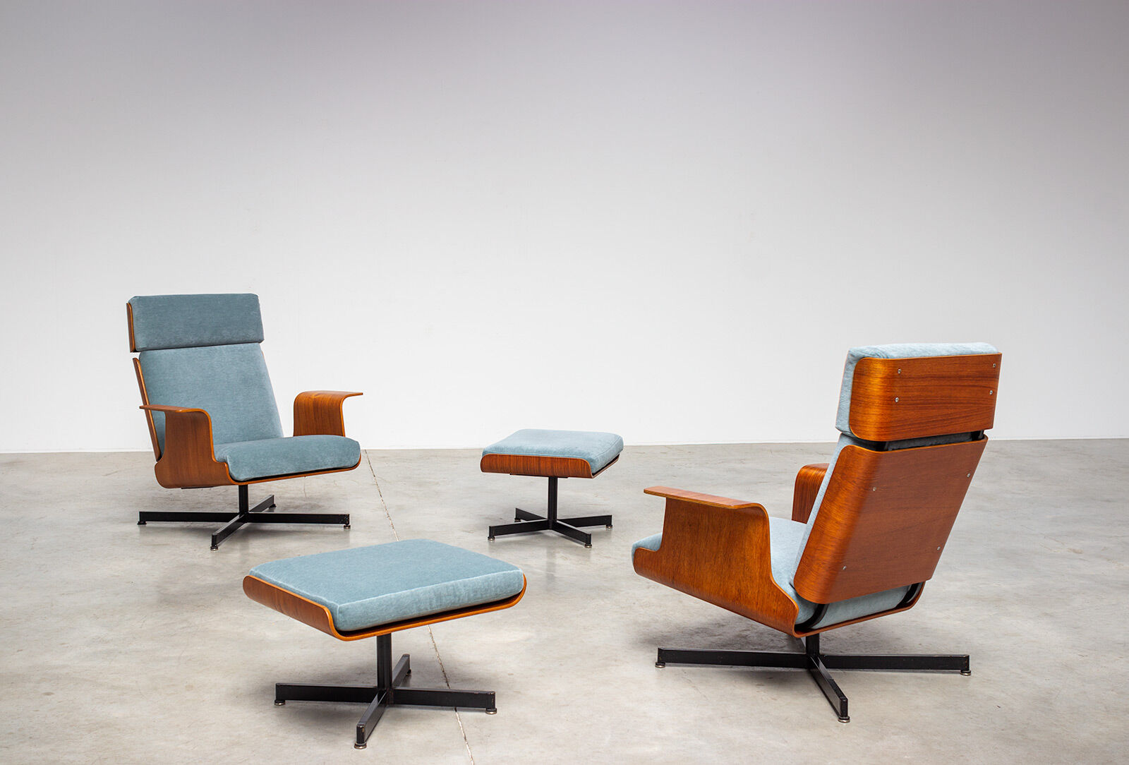 Pair of modernist teak lounge chairs and poufs 1960