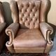 Pair of Chesterfield leather wingback armchairs