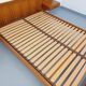 Double bed vintage Scandinavian in teak from the 1960s with integrated bedside tables.
