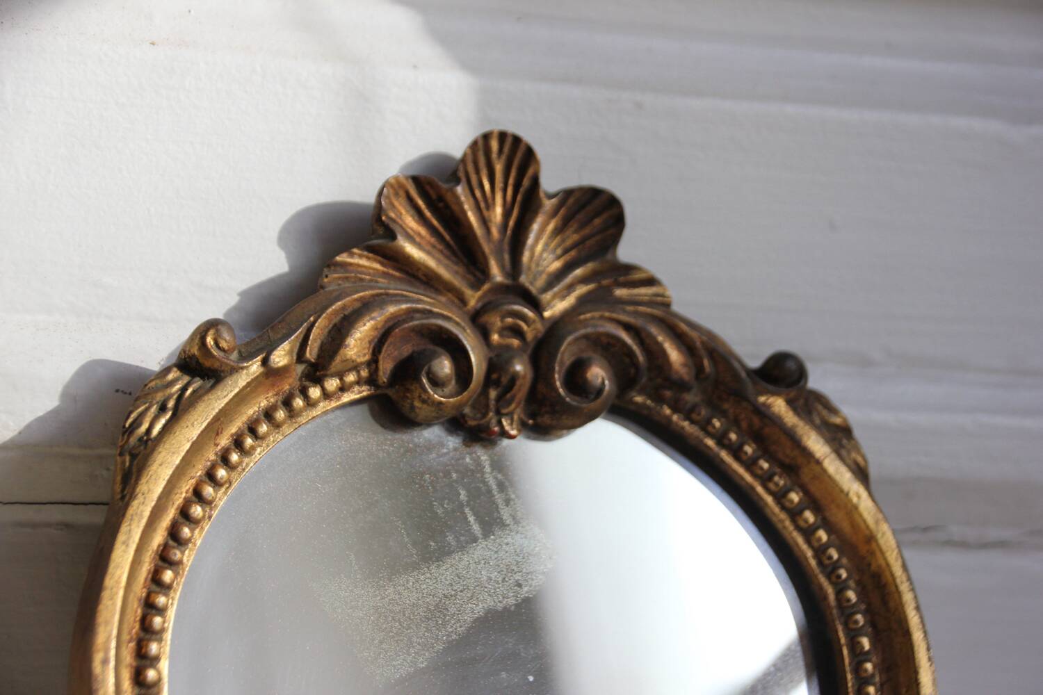 Small golden mirror in baroque style
