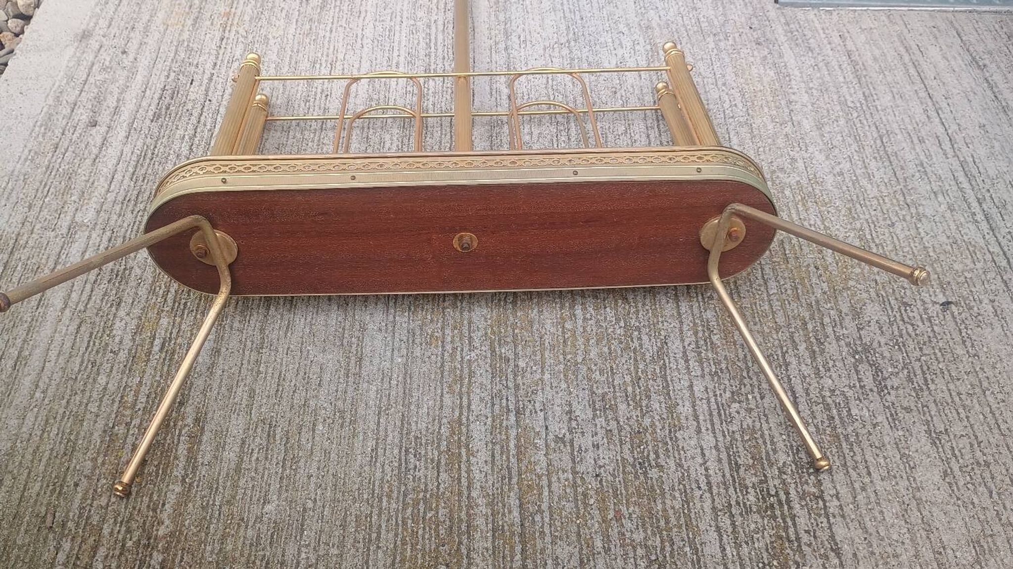 1960s brass folding magazine rack with lacquered wood decoration.