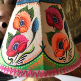 Sandstone foot accent lamp surmounted by a painted lampshade