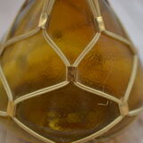 Amber decanter with wicker and golden chain