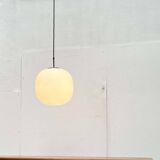 Minimalist suspended glass ball lamp from the vintage German space age by Glashütte Limburg, 1970s.