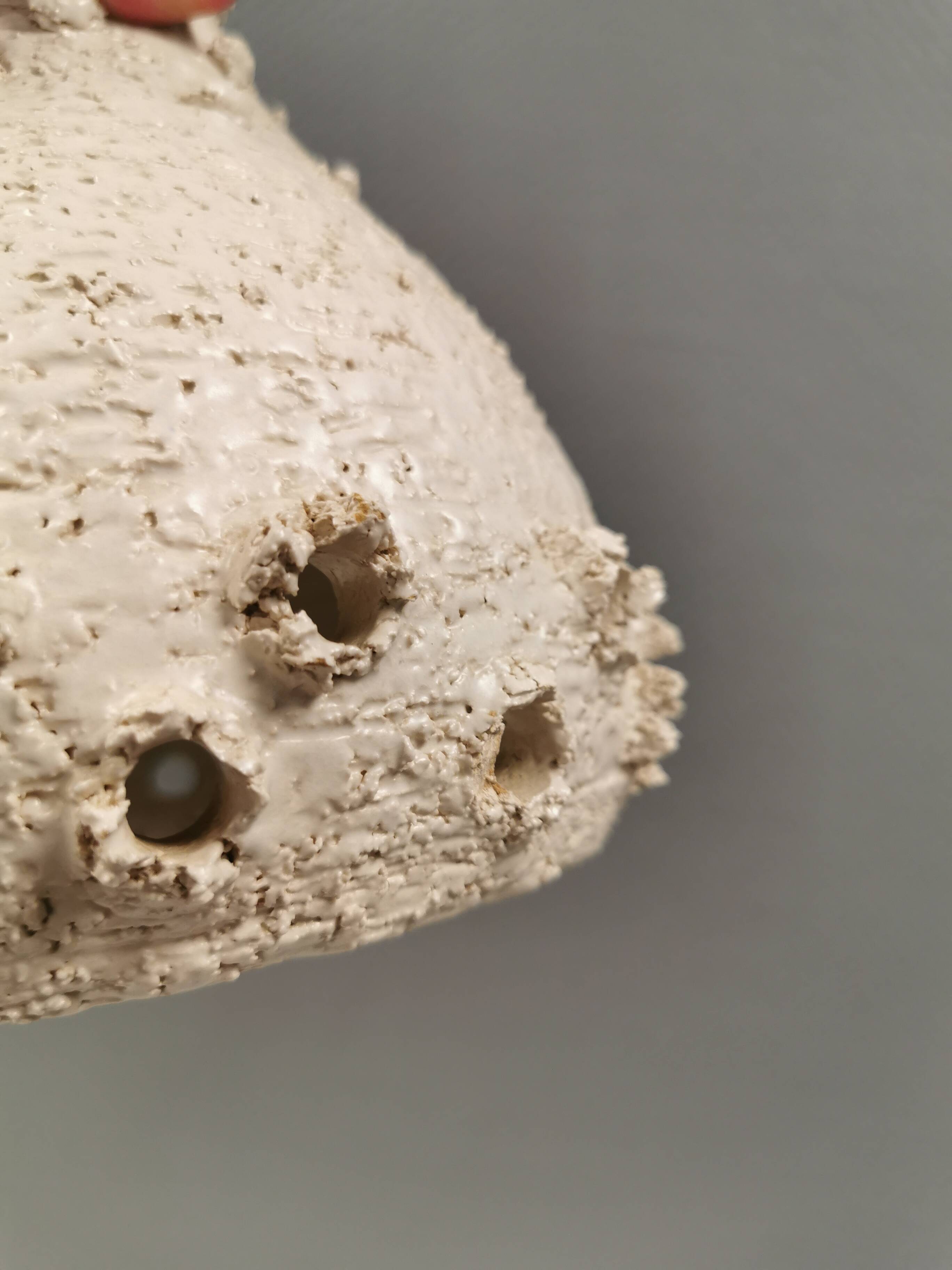 Two ceramic hanging lamps, in creamy white color, looking almost like coral