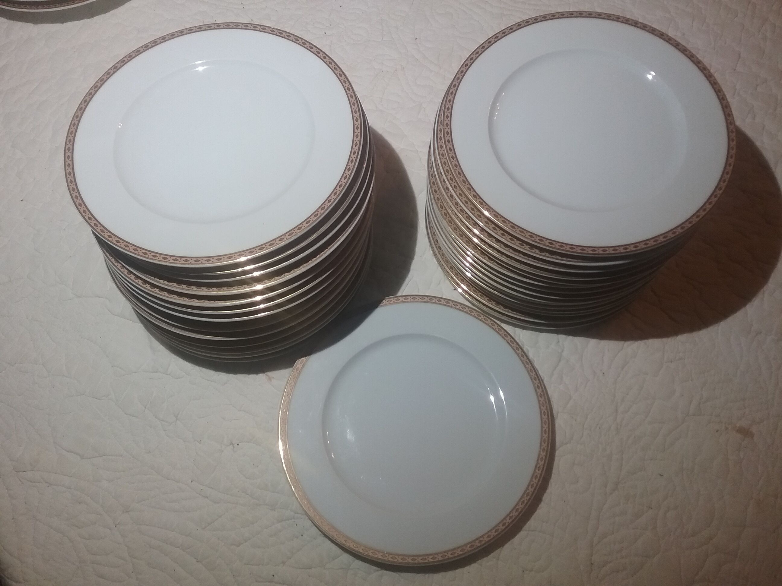 Fine porcelain dessert plates with gilded edging
