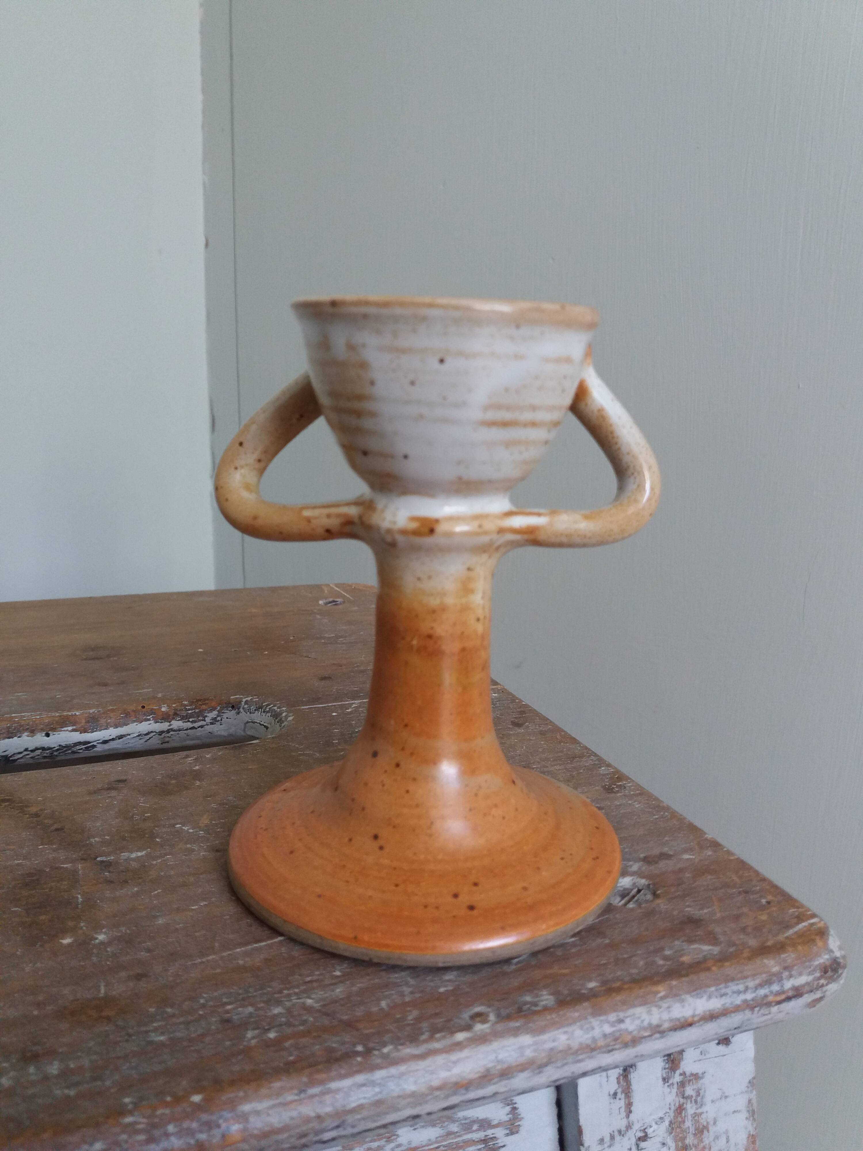 Anthropomorphic sandstone egg cup signed GL