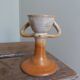 Anthropomorphic sandstone egg cup signed GL