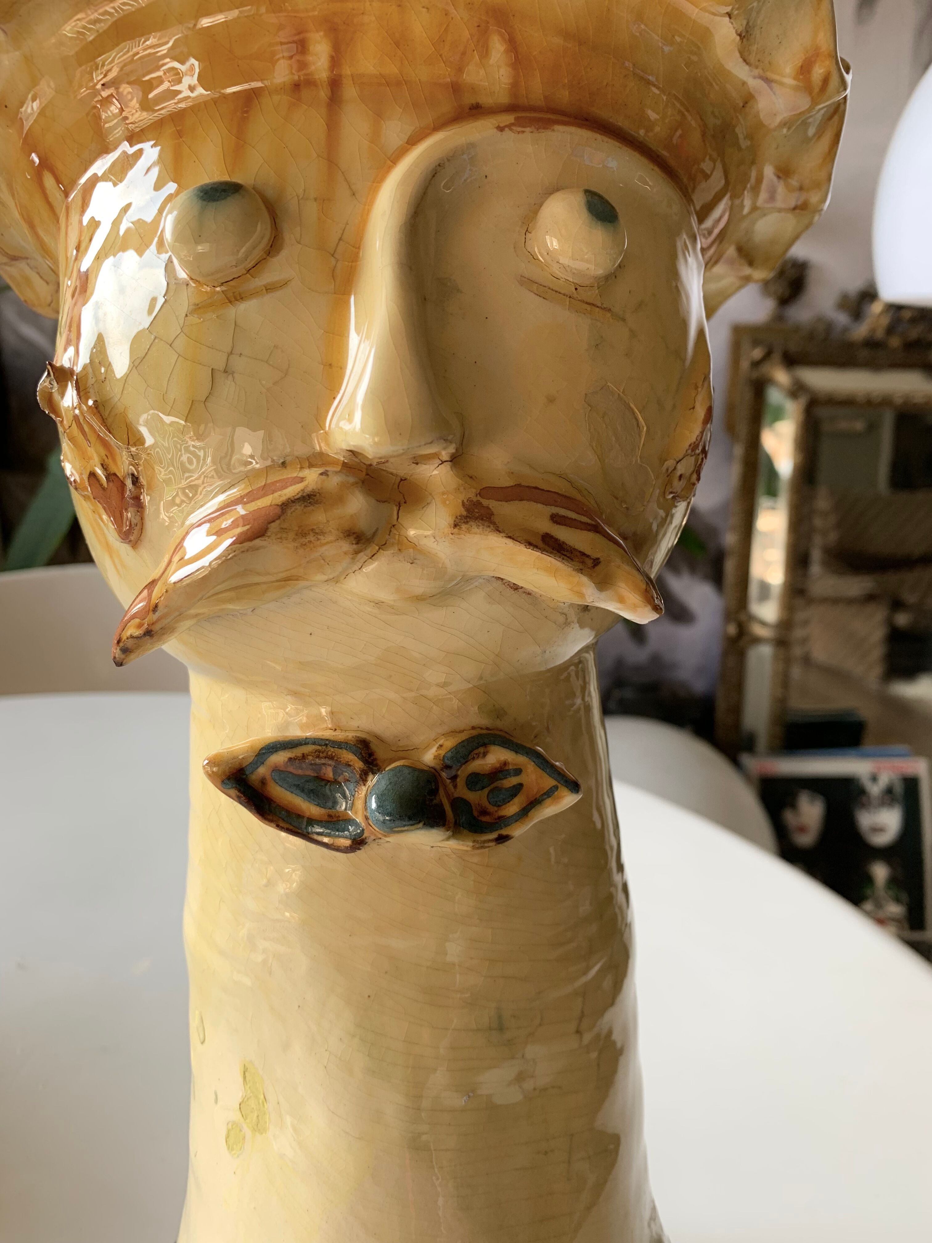 Terracotta plant holder head shape