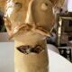 Terracotta plant holder head shape