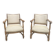 Pair of wooden and cream fabric armchairs