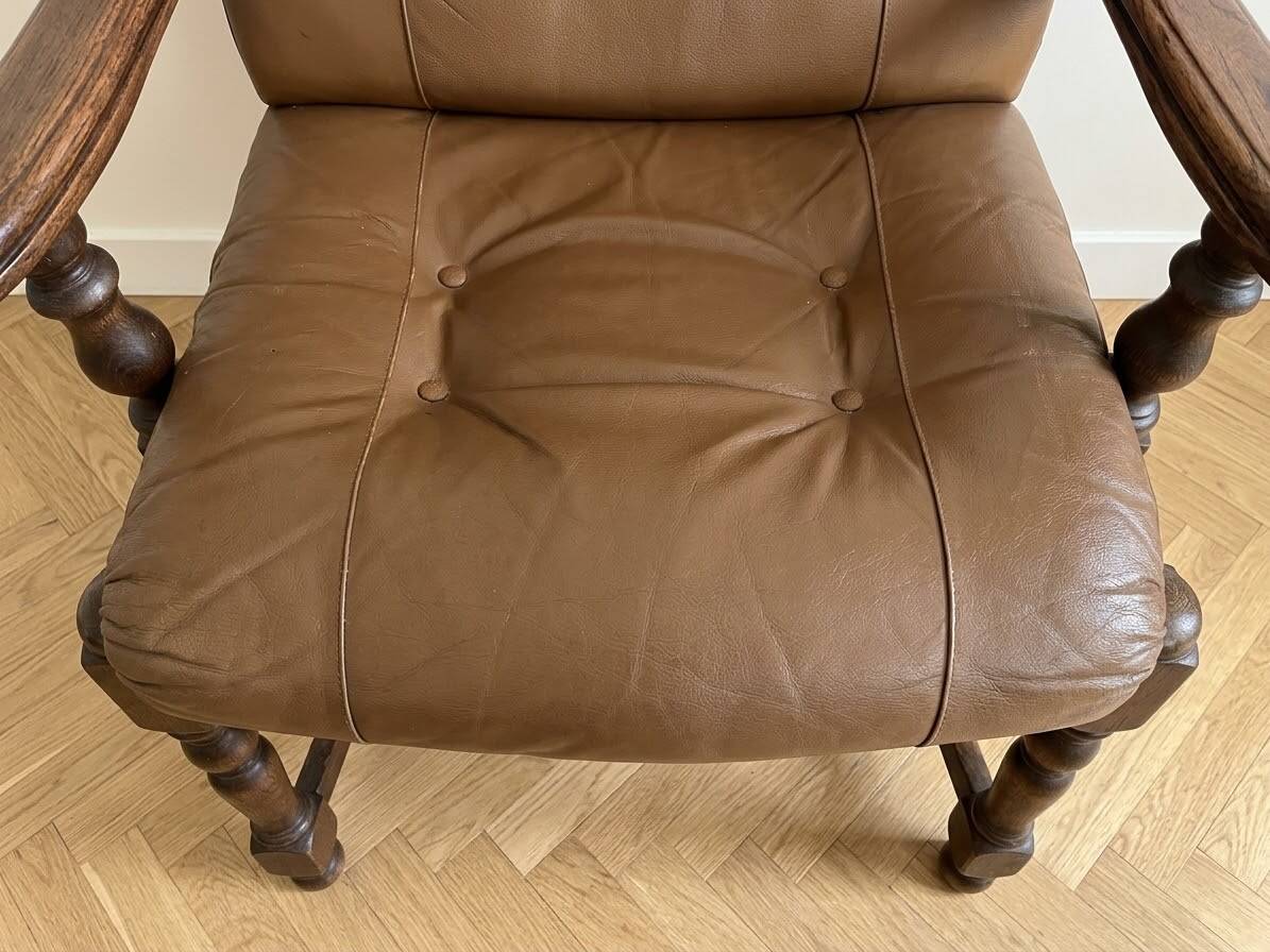 Pair of vintage 1970s armchairs in solid oak and cognac faux leather.