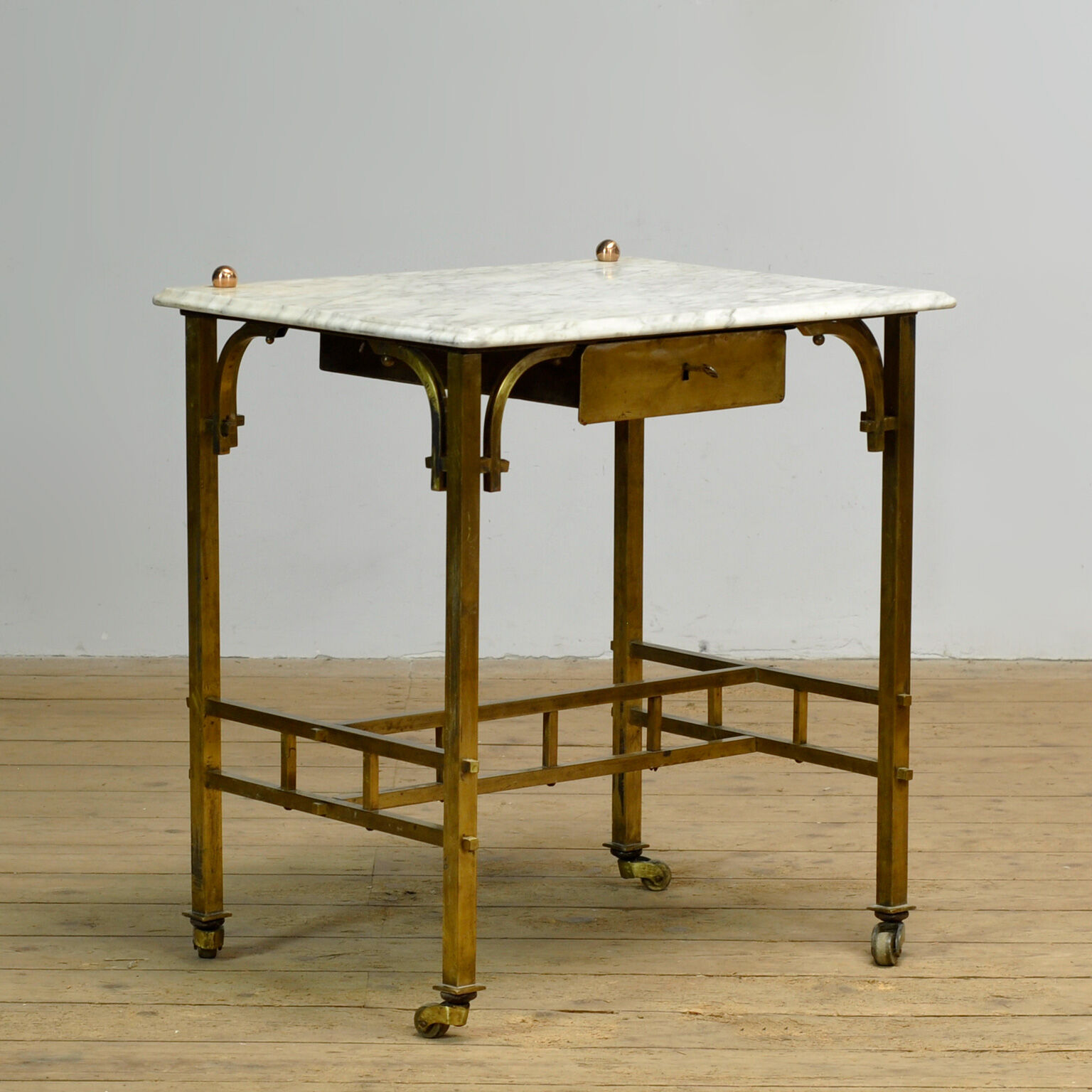 Small brass table with marble top, circa 1910