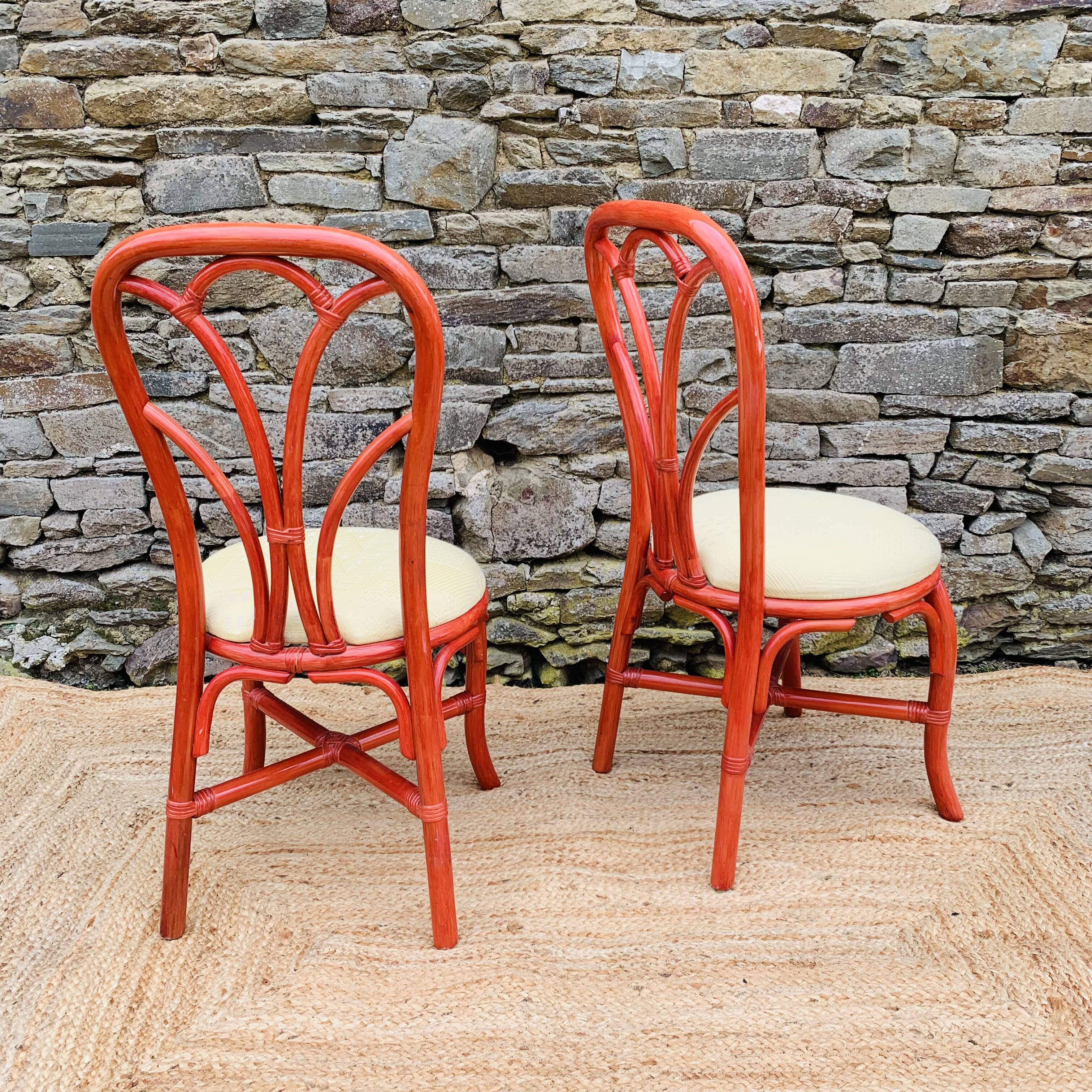 Pair of red rattan chairs and fabric