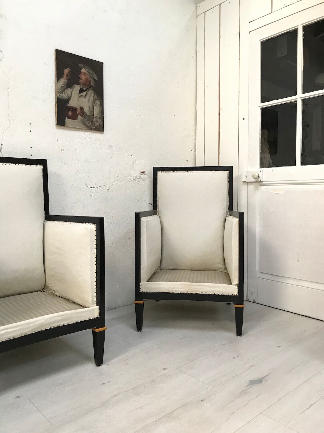 Pair of blackened wooden armchairs