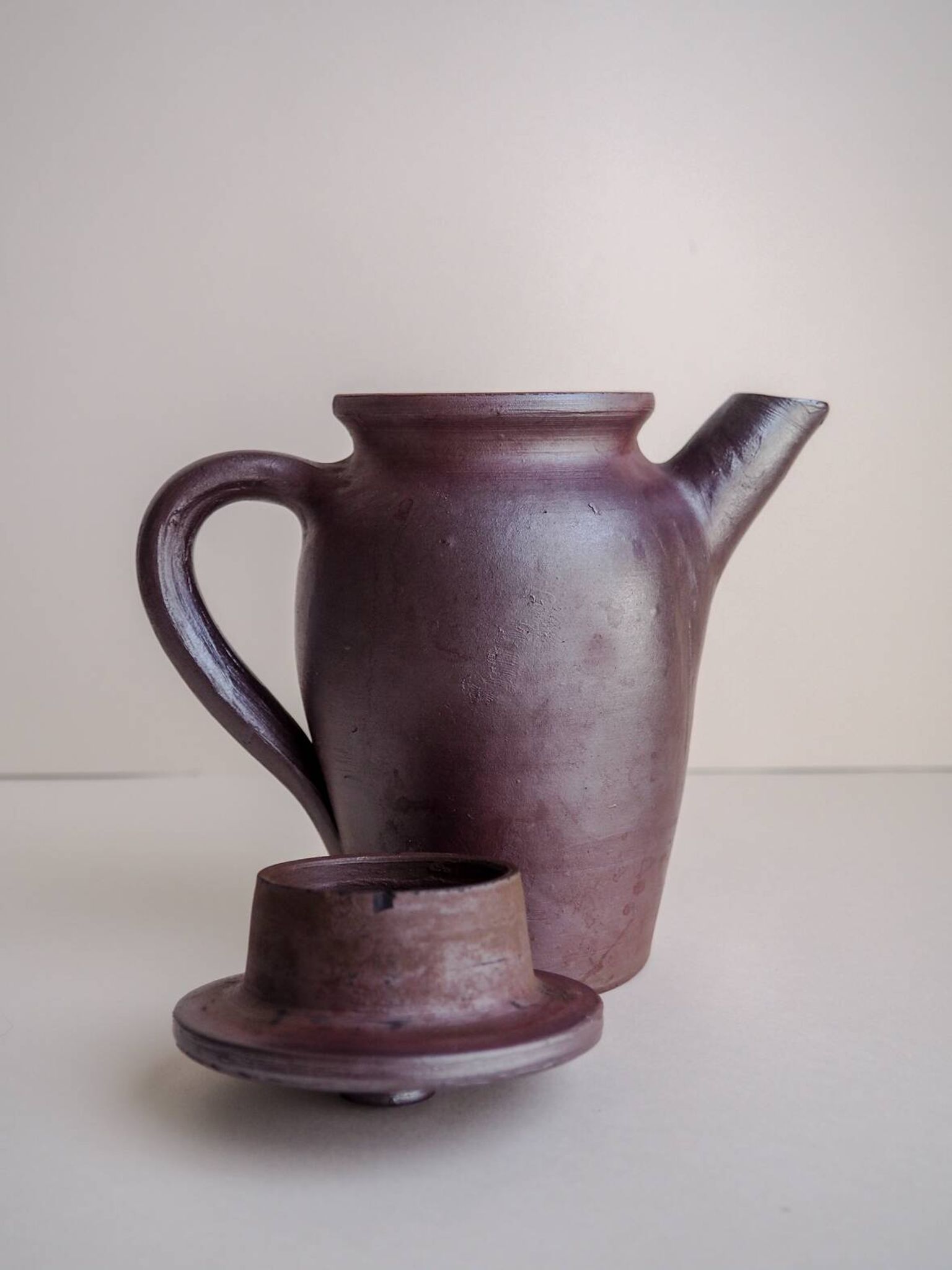Brown ceramic artisan coffee maker