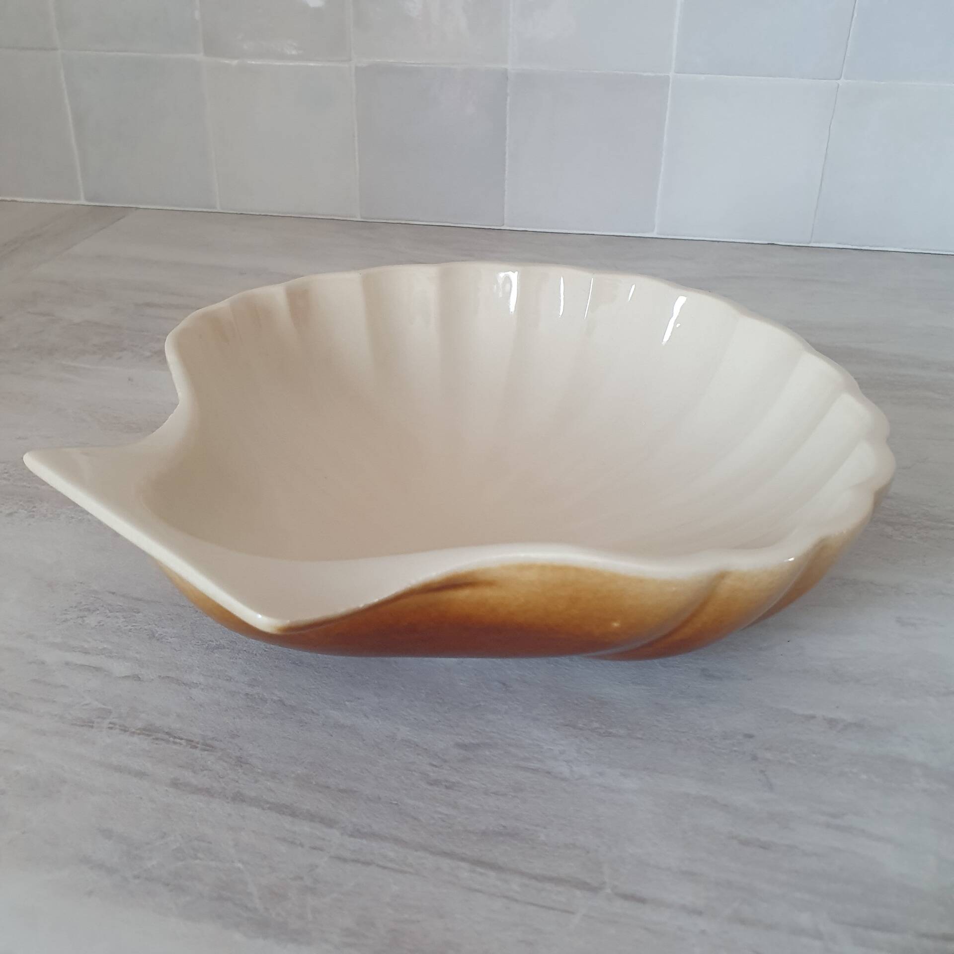Brown and white ceramic shell bowl